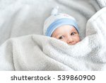 Newborn Child Relaxing In Bed...