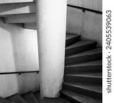 Small photo of Decrepit and creepy concrete interior staircase