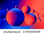 Abstract colorful background with oil on water surface. Oil drops in water abstract psychedelic. Space and universe planets styled psychedelic abstract image