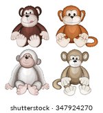 Four Plush Monkeys On A White...
