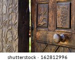 Open Wooden Door With Carved...