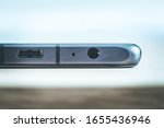 Bottom of modern mobile phone with usb type c and headphone jack