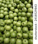 Small photo of Fresh green apples refer to apples that are characterized by their green skin and crisp, juicy texture. Green apples are usually more tart and less sweet compared to their red counterparts.