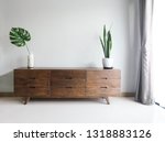 Wood TV cabinet interior wall Mockup with small plant tropical style in living room place with free space in center of picture for present the product. image
