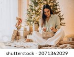 Woman opening her present on Christmas