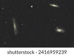Small photo of The Leo Triplet (also known as the M66 Group) is a small group of galaxies about 35 million light-years from Earth in the constellation Leo. The group consists of the spiral galaxies M66, M65 and NGC