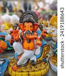 Small photo of Ganesha is the elephant-headed god who is the son of Shiva (the destroyer) and Parvati (his consort), made from clay. Ganesha's body is representative of maya, or the physical, while his elephant head