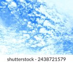 Small photo of The cloud-filled sky unveils nature's whimsical artistry, with billowing formations dancing across the azure canvas. Each wisp and puff paints a story of the wind's gentle caress