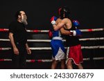 Small photo of Two boxers hugging in the ring after a club fight. Sportsmanship concept