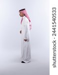 Side view of saudi man standing ...