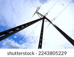 Backyard pole with high voltage power lines , bottom to top view