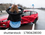 Woman Stands Near A Broken Car...