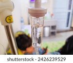 Small photo of Tomohon, North Sulawesi Indonesia - February 16, 2024: a pediatric patient is receiving a fluid transfusion while recovering in the hospital