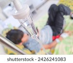 Small photo of Tomohon, North Sulawesi Indonesia; - February 16, 2024: a pediatric patient is receiving a fluid transfusion while recovering in the hospital. get well soon