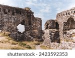 Small photo of Old Celtic Castle. Castle ruins. Castle ruins in summer time. Old life ruins. Ancient times. Ruins of Medieval Castle. Tourist places in Ireland. Tourism in Ireland.