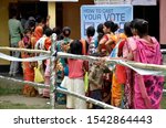Small photo of Barpeta, Assam, India. 21 October 2019. Voters stand in a queue to cast their votes at a polling station for by-polls under Jania constituency in Barpeta district of Assam.