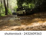 Small photo of Lembang, Indonesia - February 20th, 2024. With the flick of a switch, you engage four-wheel drive, feeling the Jeep's tires grip the earth with unwavering determination as you tackle obstacles with ea