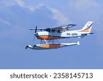 Small photo of Seaplane landing in the ocean lagoon. The takeoff of a seaplane from the ocean beach. Indonesia, East Java, 23 July 2021