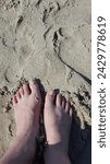 Small photo of Feet on the sand, sand, feet, summer, sandy beach, beach, rough feeling, scratchy