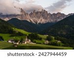 The St Magdalena Church with the Odle mountains range towering above it, Funes Valley, Dolomites, Italy