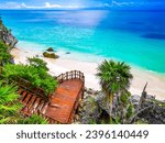 Small photo of Natural seascape and beach panorama view at the ancient Tulum ruins Mayan site with temple ruins pyramids and artifacts in the tropical natural jungle forest palm in Tulum Mexico.