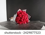 Small photo of 25 pcs Pink roses bouquet with white wrapper with black border