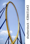 Small photo of roller coaster yellow rail, blue sky