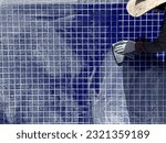 Small photo of Tile Grouts. Steps to renovate swimming pool grout
