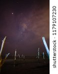 milky way over a beach with a... | Shutterstock . vector #1179107230