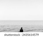 Small photo of woman looking into the void, sea void