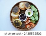 Small photo of This unedited photo invites onlookers to partake in the visual feast of an Arabic Breakfast Plate, celebrating the simplicity, diversity, and wholesome goodness of a meal that transcends cultural boun