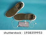 green shoes with phone and... | Shutterstock . vector #1938359953
