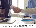 Small photo of Close-up handshake between business partners. Businessman and client shaking hands, confirming deal after successful negotiation. Cooperation, partnership, trust, mutual benefit and gratitude concepts