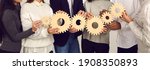 Small photo of Teamwork, partnership, international cooperation concept. Hands of different ethnicity people business team or students friends holding various wooden gears as symbol of unity, support, common goals