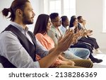 Small photo of Happy multiethnic diverse people clap hands meet speaker or presenter at meeting or seminar in office. Smiling international employees applaud thank for presentation. Acknowledgement concept.