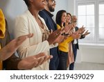 Small photo of Close up of diverse multiracial businesspeople clap hands meet welcome coach or presenter at briefing. Multiethnic employees applaud show acknowledgement or appreciation at business training.