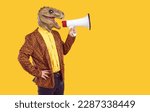 Small photo of Creative man with dinosaur head makes loud advertisement with help of loudspeaker. Eccentric man in dinosaur mask and leopard print jacket is loudly announcing crazy discounts on orange background.
