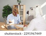 People with funny animal heads at bizarre job interview. Man wearing dinosaur mask sitting at office table with HR manager in horse mask, answering questions and telling about his work experience