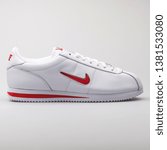 Small photo of VIENNA, AUSTRIA - AUGUST 7, 2017: Nike Cortez Basic Jewell QS TZ white and red sneaker on white background.