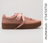 Small photo of VIENNA, AUSTRIA - FEBRUARY 19, 2018: Puma Vikky Platform Ribbon Bold rose and brown sneaker on white background.
