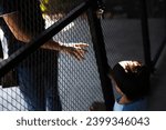 Small photo of Little Boy opening the door to the robber. Child Is Opening The Door To Stranger. Little boy alone at home.
