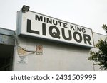 Small photo of Costa Mesa, California - USA - February 26-2024: Old Minute King LIQUOR sign in Costa Mesa California. Closed and Abandoned Building. Neon Sign. Liquor Sign. Liquor Store. Booze and Spirits. Drink it.