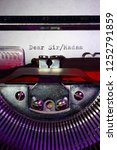 Small photo of Vintage typewriter with the words dear sir/madam printed on a letter
