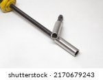 screwdriver head for interchangeable bits and hex shank extension bar, chromed bits holder, closeup