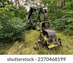 Small photo of Kalety, Poland, August 4, 2023: Forestry harvester during a stoppage among trees in the fores.