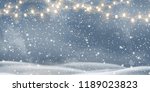 snowy night with light garlands ... | Shutterstock .eps vector #1189023823