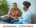 Small photo of Afro hispanic-latino father and daughter together at home. Family is everything - Family Tie. Adult Daughter Hugging Senior Man. Senior black man and his middle aged daughter embracing, close up