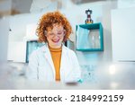 Small photo of Young Scientist Working in The Laboratory. Female Scientist Working in Nuclear Magnetic Resonance Laboratory, Researching Diseases. This could be the next groundbreaking discovery