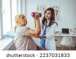 Small photo of I feel tremendous pain in that area of my arm. Physiotherapist working with patient. A picture of a physio therapist giving an arm massage. Modern rehabilitation physiotherapy female worker