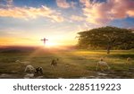 Small photo of Flock of sheep on cross of Jesus christ and sunset background